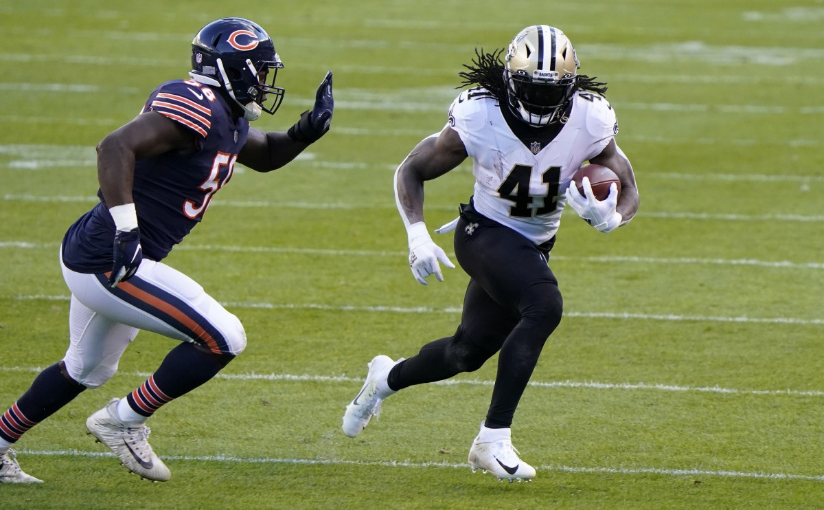 New Orleans Saints running back Alvin Kamara (41) rushes the ball against the Chicago Bears. Mandatory Credit: Mike Dinovo-USA TODAY Sports